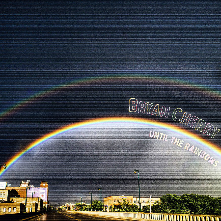 Bryan Cherry Until The Rainbows image of two rainbows with a dark sky fading to lighter toward horizon and office buildings in the distance